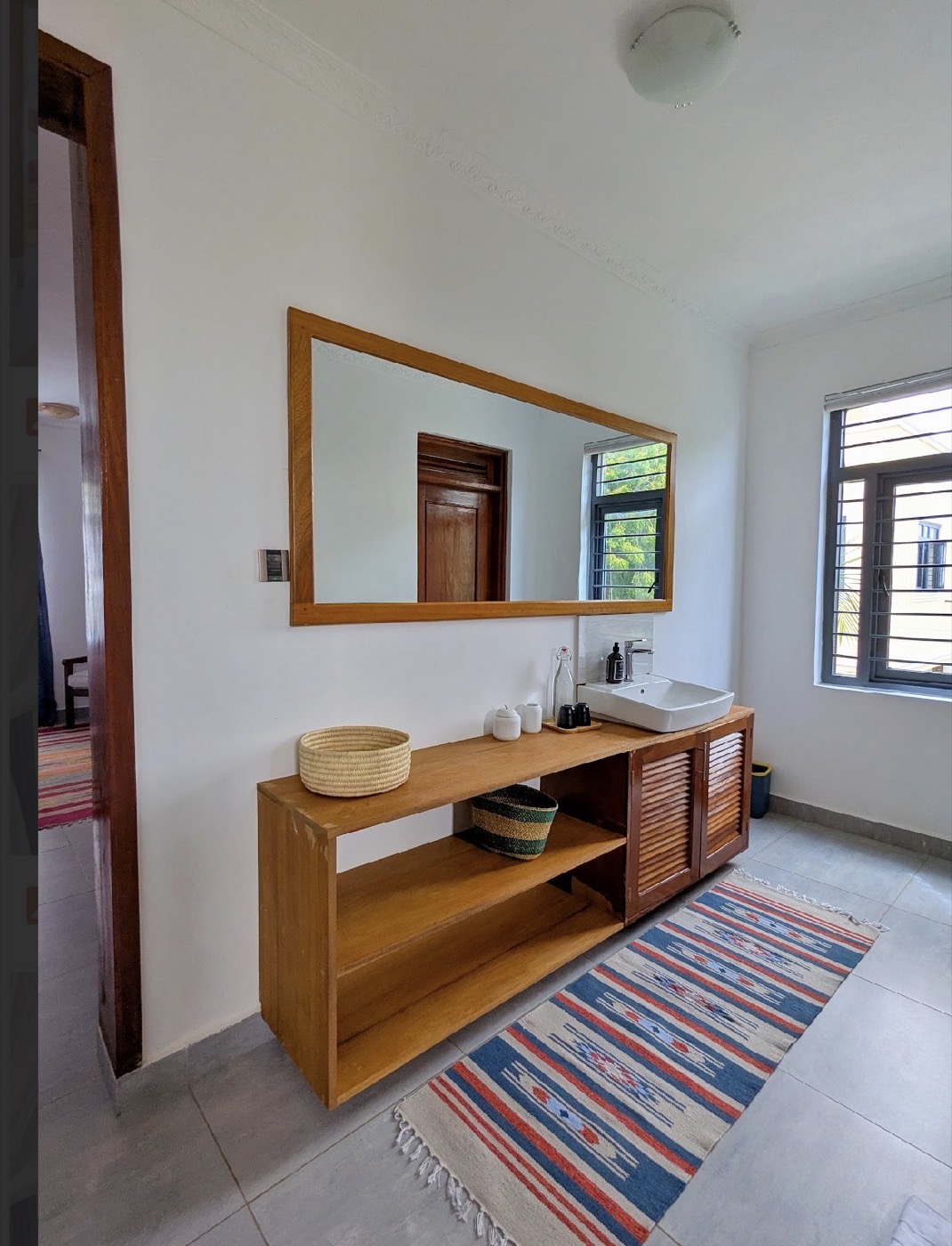 Bathroom vanity with a kilim runner