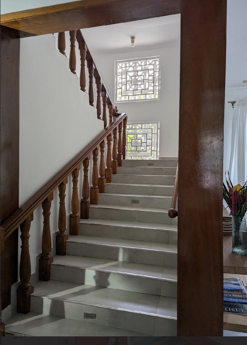 Staircase lit through carved breeze blocks