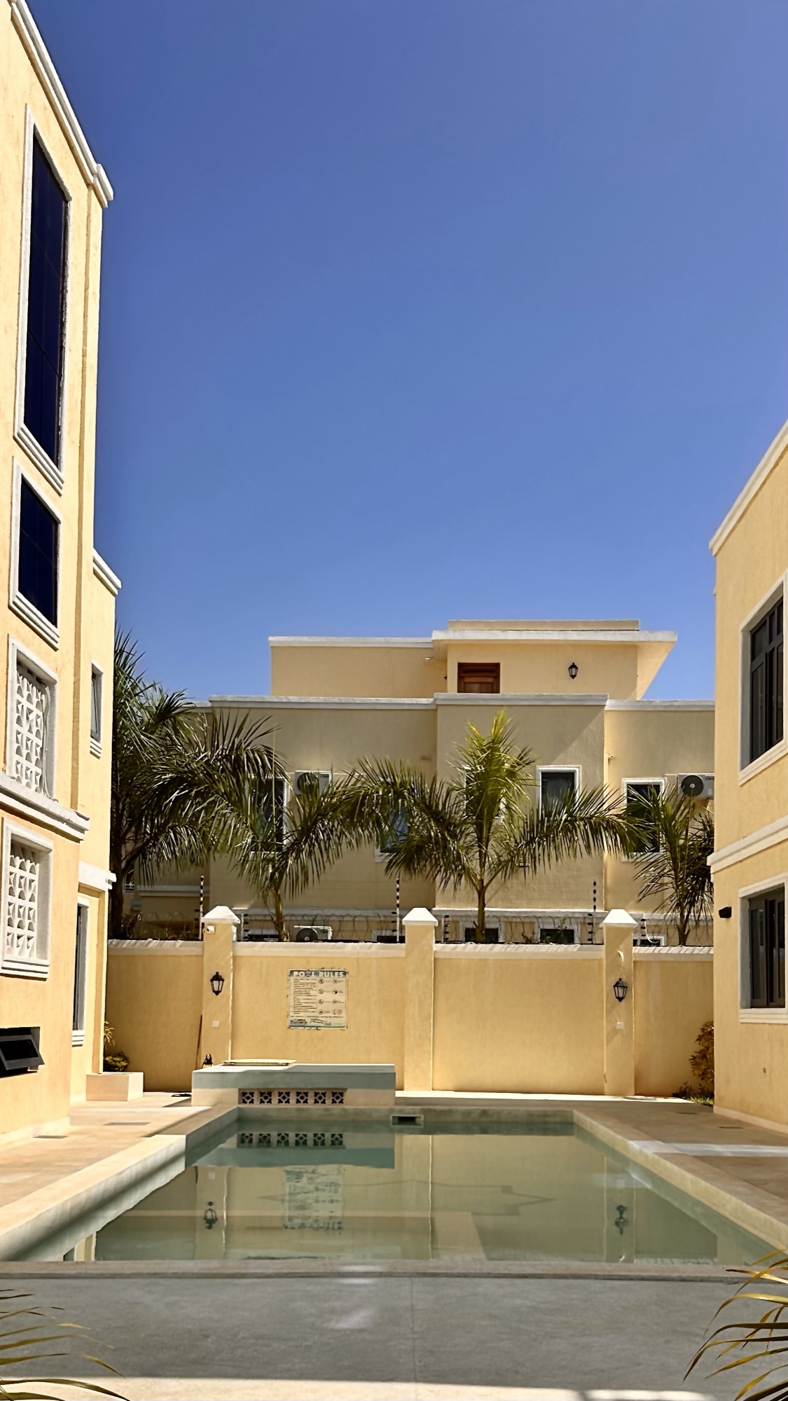 Mila Samawati above the shared pool courtyard