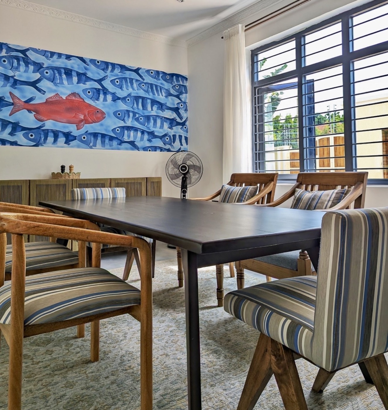 The dining room beneath the fish mural
