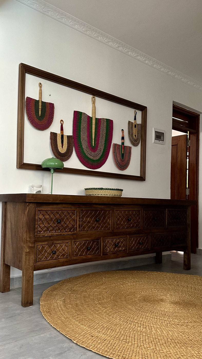 The console of framed woven fans