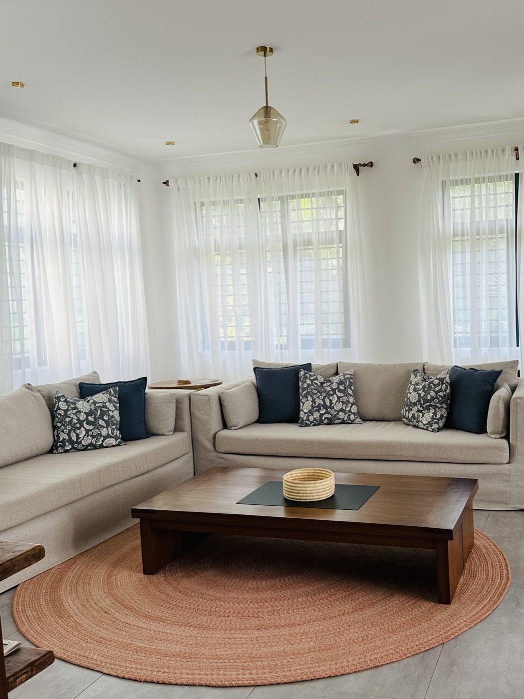 Samawati's living room, linen sofas around the low teak table